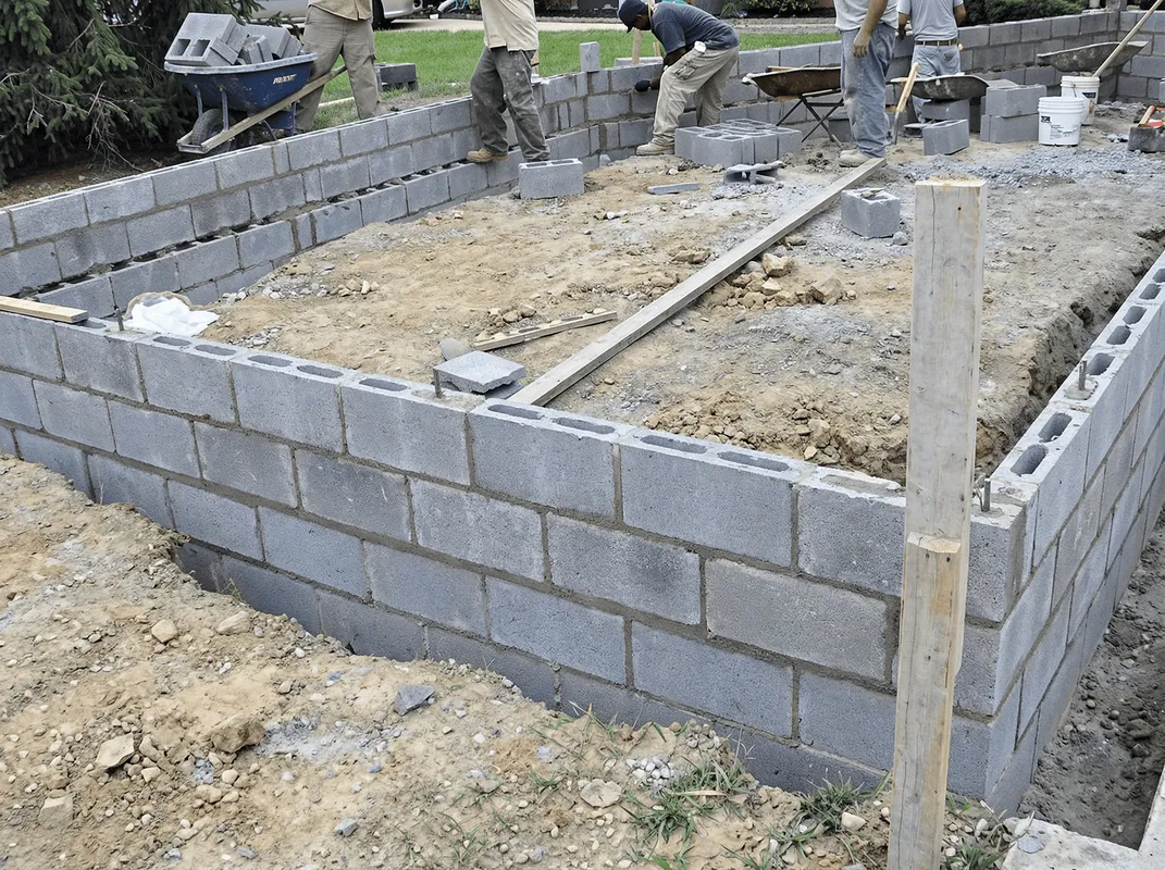 Professionals building a foundation with blocks in Wilmington, NC