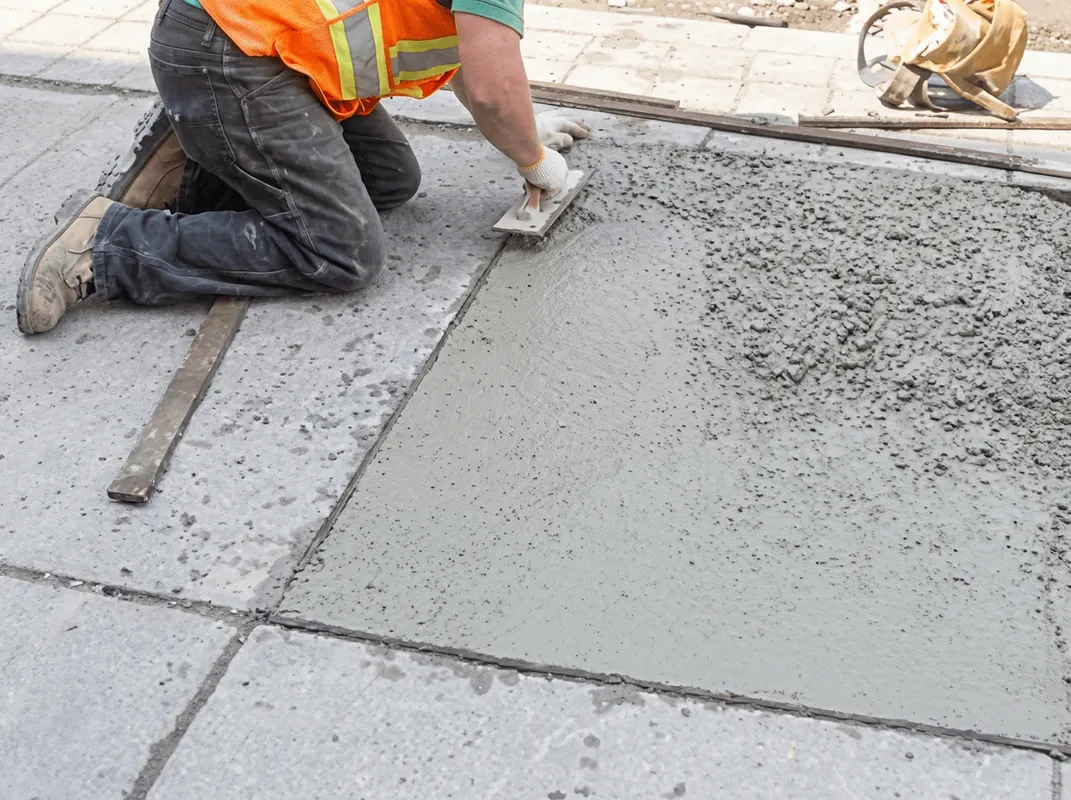 Professional repairing a concrete floor in Wilmington, NC